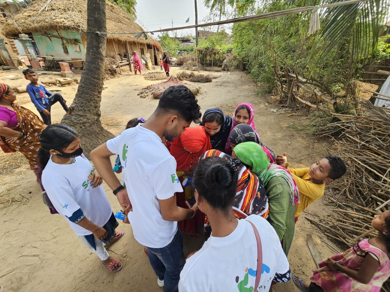 Volunteers distributing sanitary pads for Women Empowerment